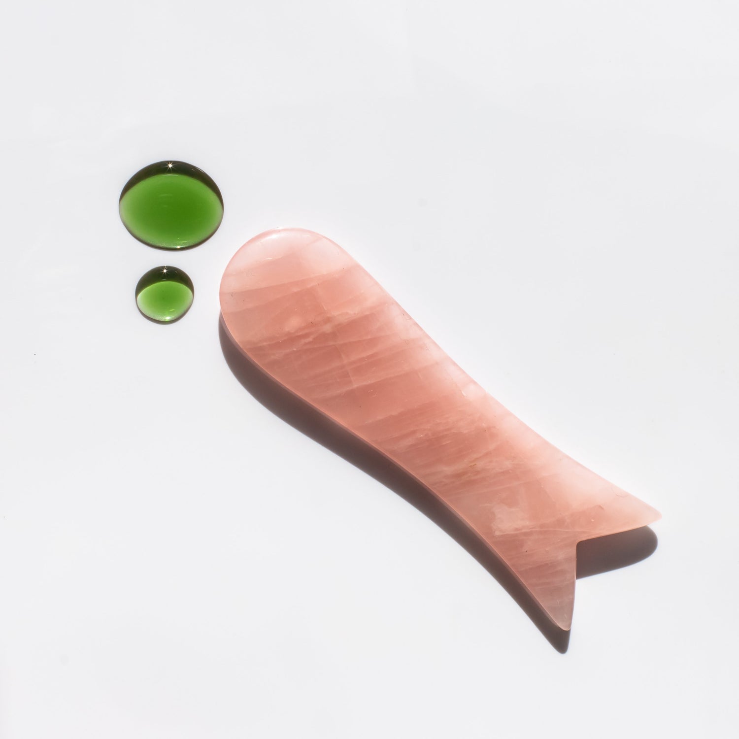 Rose quartz gua sha face sculptor